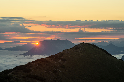 View from Mount Frechjoch to the sunrise over the Veitsberg and the Kaiser Mountains, Tyrol, Austria