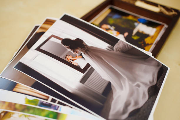 istock printed wedding photos and a wooden box with a flash drive. 1444744896