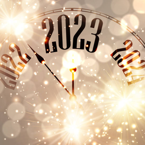 istock New year clock showing 2023 with golden firework and bokeh lights. 1444746852