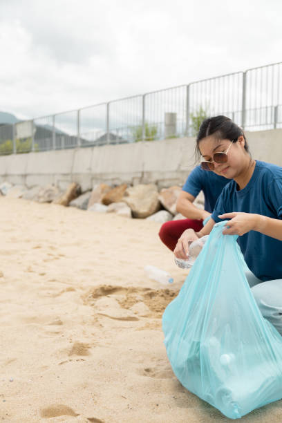 istock volunteering to do a beach clean up 1444753147