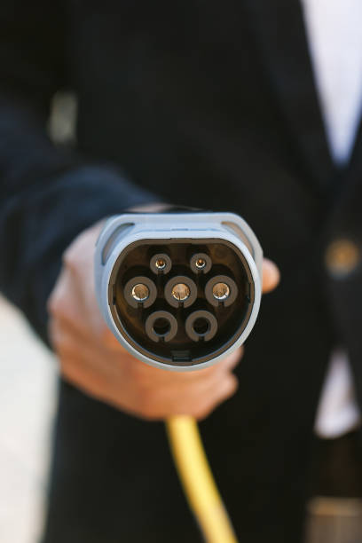 istock Type 2 CCS plug port cable on electric vehicle. Fast charging socket type 2 combo electric car. DC - CCS type 2 EV charging connector at EV car. Eco friendly alternative energy green environment. 1444754278