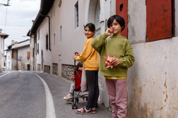 Three sisters watching aside while coming back home from shopping fruits