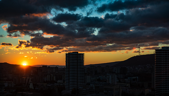Tbilisi city centre in sunrise time with dramatic sky view