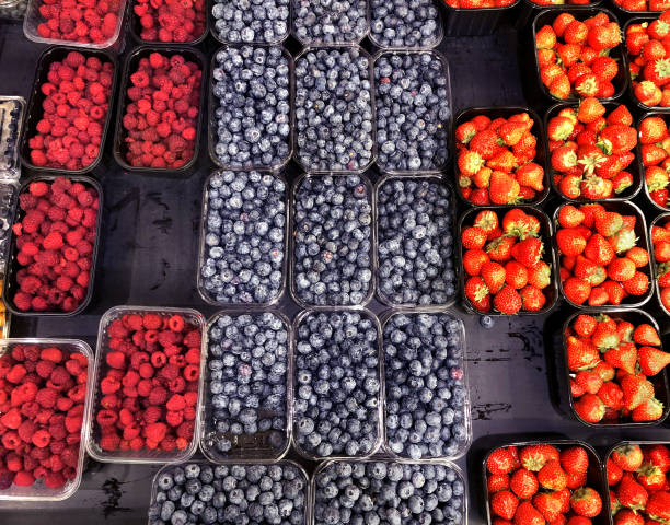 buying fruits and  berries ( raspberries, blueberries, blueberries, strawberries, gooseberries)at the market