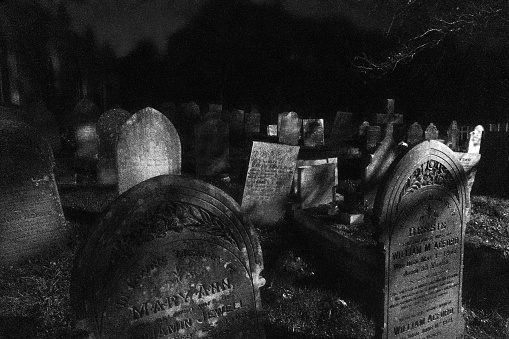 Gravestones at night