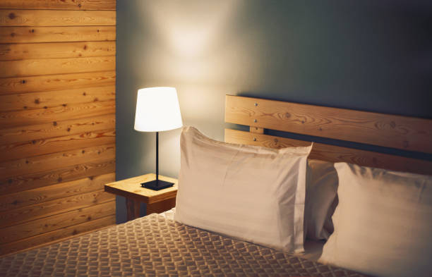 istock Night scene in cozy room, nightstand with lamp 1444762277