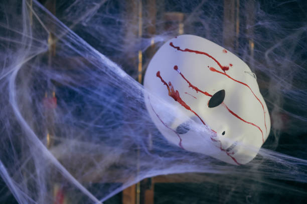 istock Color image of a white mask, painted with blood 1444762589