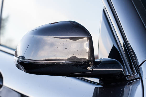 istock Close up front view of car side mirror. Front rear view mirror on the car window. Car exterior details. 1444764739