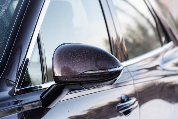istock Close up front view of car side mirror. Front rear view mirror on the car window. Car exterior details. 1444764740