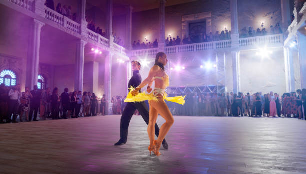 istock Couple dancers  perform latin dance on large professional stage 1444768627