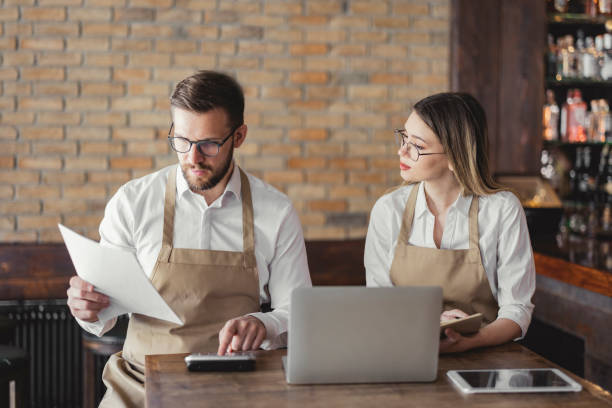 istock Cafe owners accounting in a coffee shop 1444769703