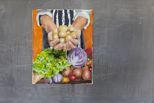 Grocer presenting potatos and vegetables at grocery oil painting hanging in kitchen on grey wall