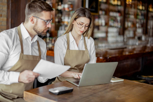 istock Cafe owners accounting in a coffee shop 1444769850