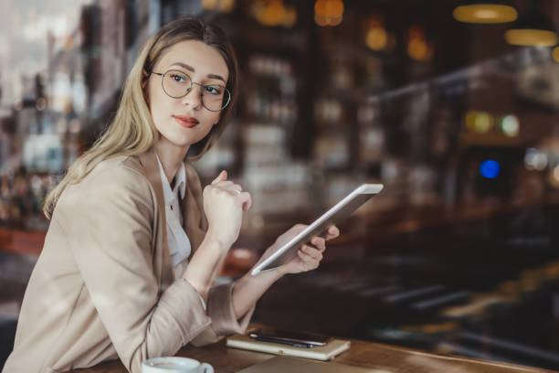 istock Businesswoman Looking Away in a Cafe 1444770093