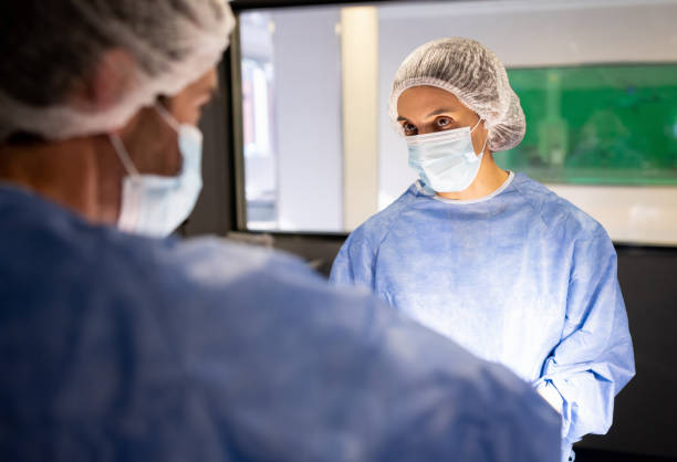 istock Doctor talking to the surgeon while in surgery at the operating room 1444772641
