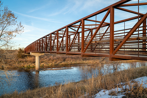 bike trail and a footbridge over a river - South Platte River Trail near Brighton, Colorado