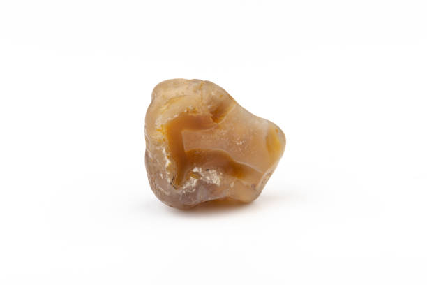 istock Multicolored gemstone, tumbled mineral. Bostwan agate of various sizes on a white background. 1444789222