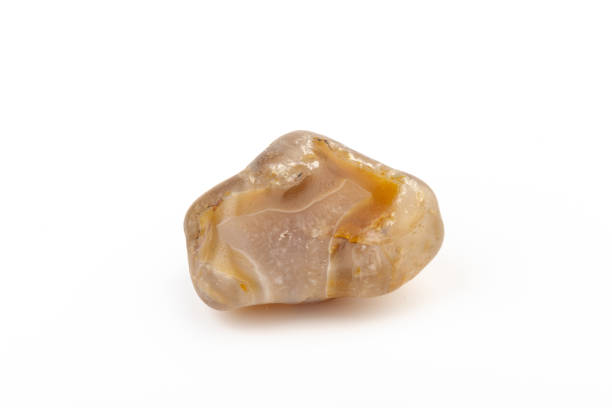 istock Multicolored gemstone, tumbled mineral. Bostwan agate of various sizes on a white background. 1444789231
