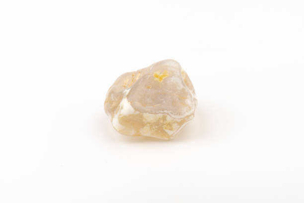 istock Multicolored gemstone, tumbled mineral. Bostwan agate of various sizes on a white background. 1444789245