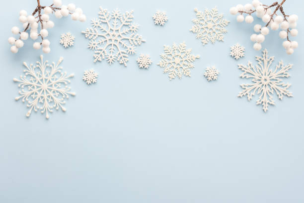 istock White snowflakes on a blue background 1444794316