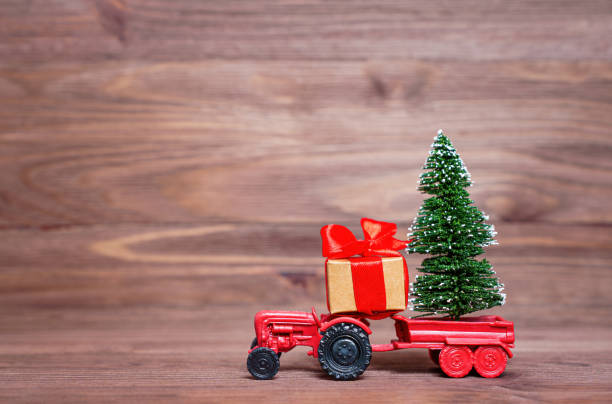 Toy tractor with Christmas tree and gift box