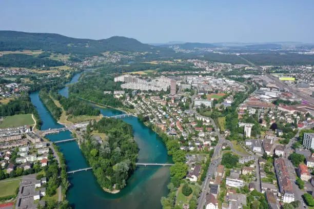 Aarau with the modern city district. The high angle image was captured during summer season and shows the river aare and in the background the large residential district Telli.