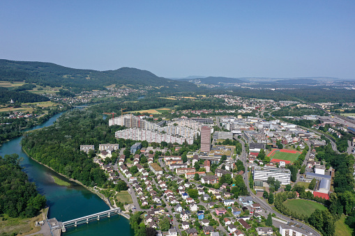 Aarau with the modern city district. The high angle image was captured during summer season and shows the river aare and in the background the large residential district Telli.