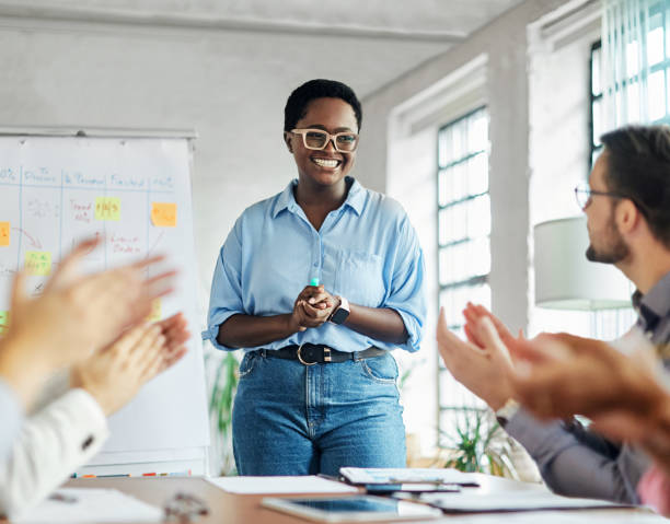 young business people meeting office teamwork group whiteboard presentation seminar woman businesswoman startup creative applause success