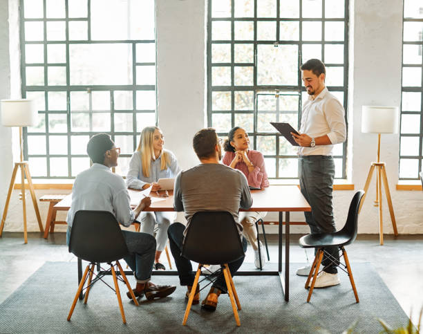 istock young business people meeting office teamwork group whiteboard presentation seminar woman businessman businesswoman startup project idea training student total 1444802475