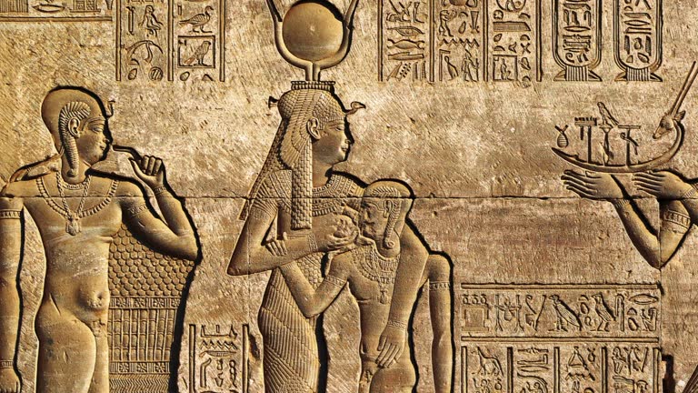 Hieroglyphic carvings in ancient egyptian temple