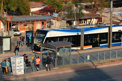 Antalya, Turkey - April 15, 2022: Antray light tram, a popular mode of transportation in Antalya, stands at Fatih station in Kepez district.