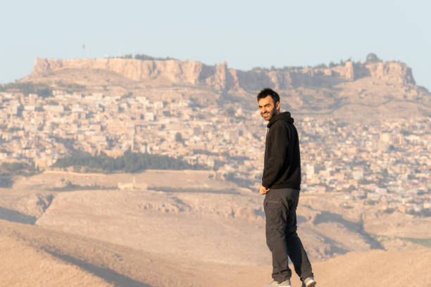 istock man with historical mardin view behind him looking at camera 1444804289