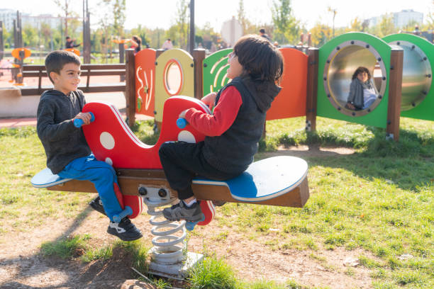 istock kids having fun together in the park 1444804691