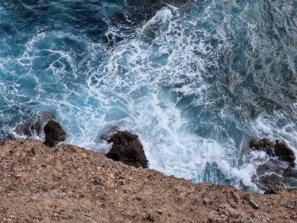 istock waves crashing on the rocks 1444808413