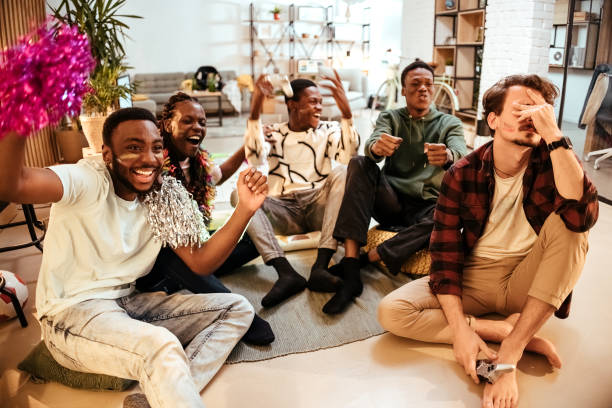 istock Friends playing video games at home 1444812511