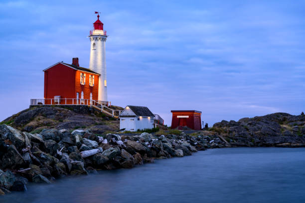 Evening shot of Fisgard Lighthouse (Fort Rodd Hill National Historic Site), Victoria, BC Canada Victoria, BC Canada - August 9, 2019: Evening shot of Fisgard Lighthouse (Fort Rodd Hill National Historic Site), Victoria, BC Canada colwood photos stock pictures, royalty-free photos & images