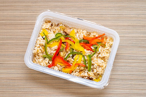 Packed frozen vegetarian stir-fried rice prepared by a local restaurant in Taiwan, after microwave heating.
