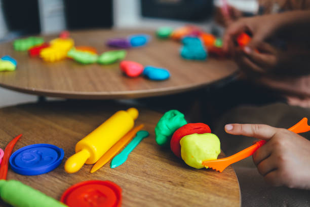 istock The child holds plasticine in his hands. Modeling workshop concept 1444821785