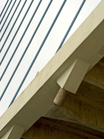 Engineering details of a cable stayed bridge as it crosses a waterway on the coast of Delaware. The Charles Cullen memorial bridge exhibits the design and structure of a cable stayed bridge.