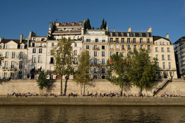 istock People enjoying the evening in Paris river banks 1444825065