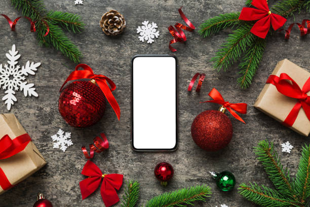 istock Digital phone mock up with rustic Christmas decorations for app presentation top view with empty space for you design. Christmas online shopping concept. Tablet with copy space on colored background 1444826029