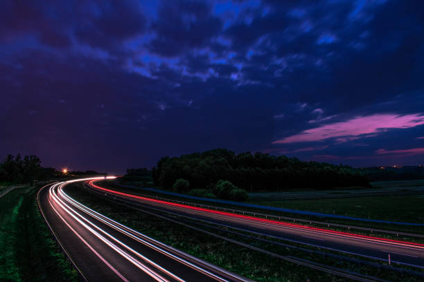 istock Lights left by passing cara on the highway 1444826660