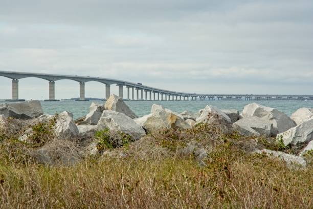 istock Concrete box girder bridge spanning Oregon Inlet viewed from riprap coastline 1444827688