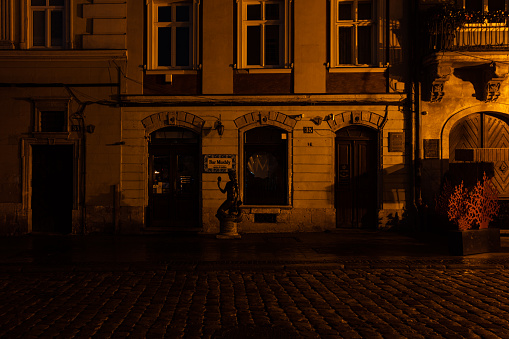 Lviv, Ukraine - November 23, 2022: Lviv during partial blackout after  Russian missile attack. Market square at night