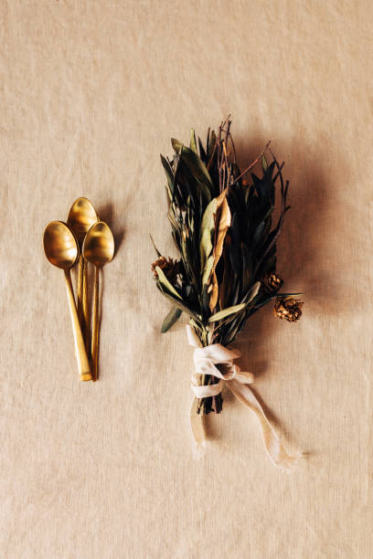 istock Beautifully Arranged Golden Spoons With Dry Leaf Bouquet Beside Them (Wedding Decoration) 1444828670