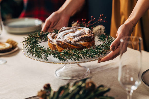 A Close Up View Of An Unrecognizable Woman Preparing Table For Christmas Dinner