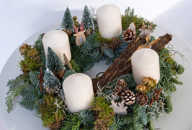 Advent Wreath Advent wreath with four white candles advent candle wreath adventskranz stock pictures, royalty-free photos & images