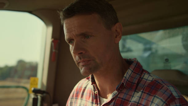 istock Tractor driver checking cabin before grain harvesting closeup. Focused man work 1444834828