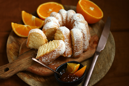 Soft and tender orange cake in powdered sugar.