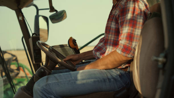 istock Driver resting tractor machine seat close up. Unknown farmer working grain field 1444835852